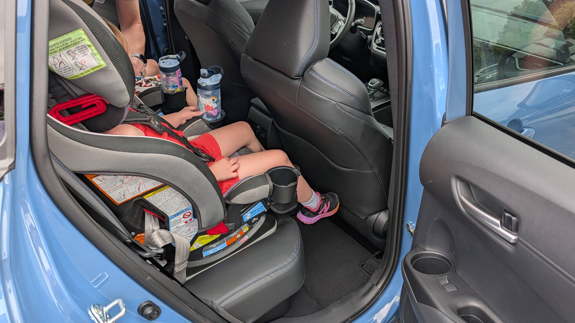 My daughters crammed into the back of the 2026 Toyota Corolla Cross Hybrid XSE