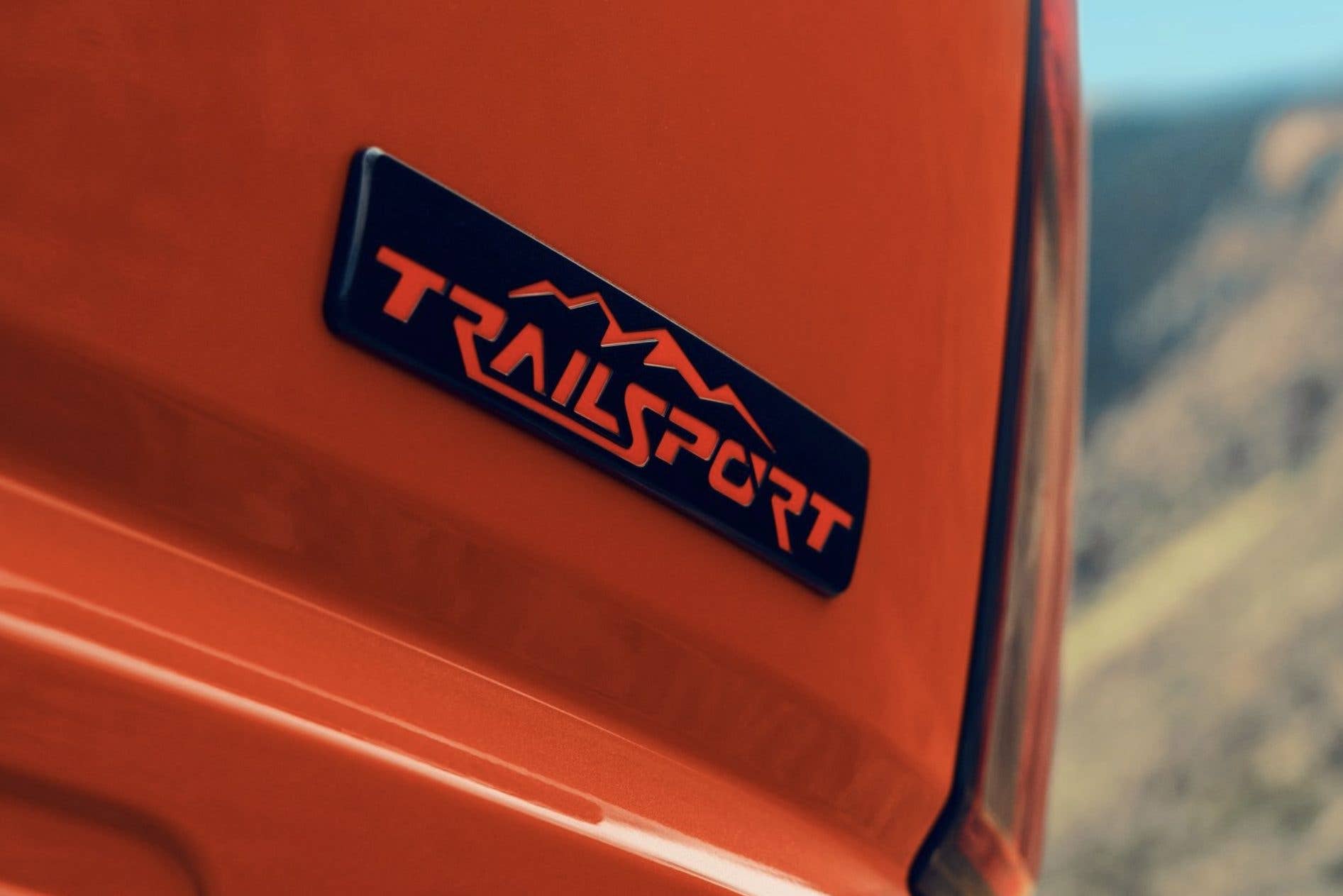 2026 Honda Passport TrailSport in Sunset Orange rear liftgate model script