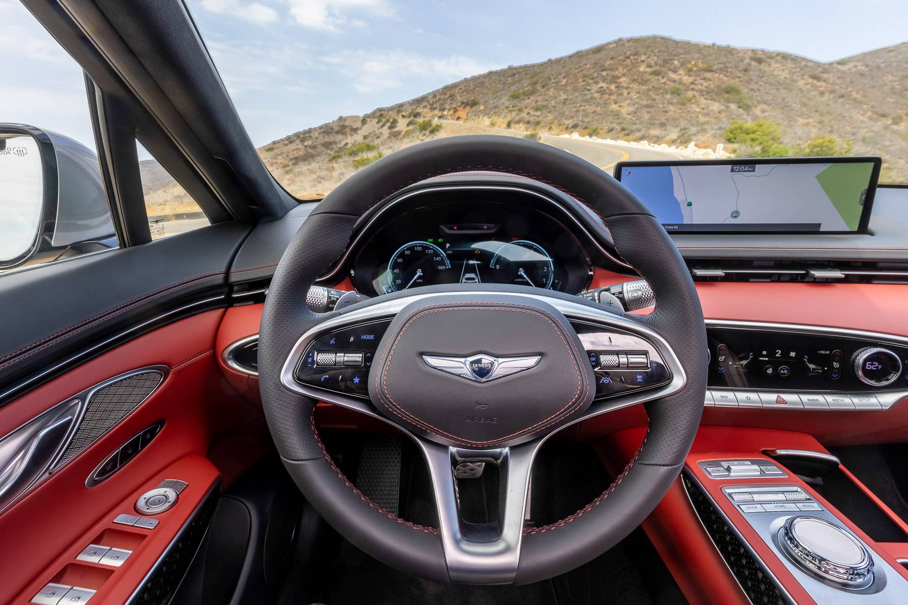 2025 Genesis GV70 with black and red interior driver area