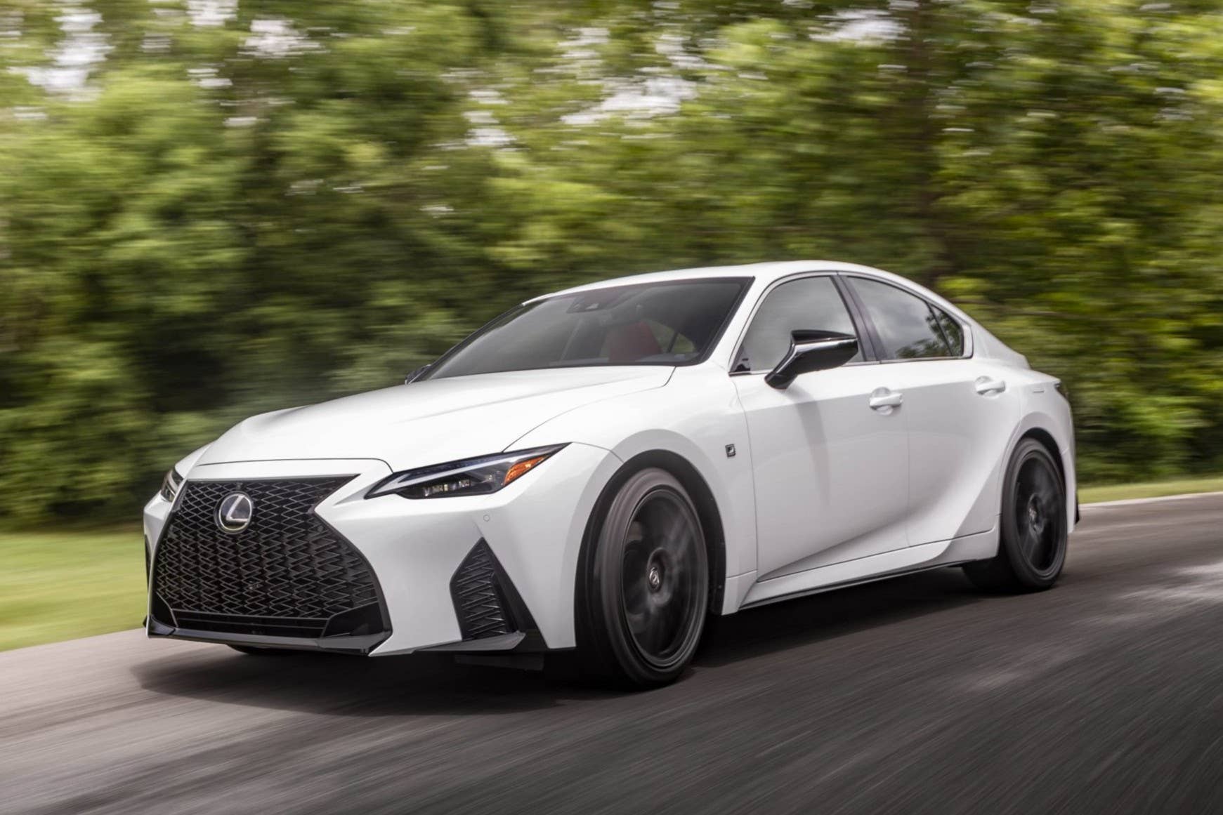 2025 Lexus IS 350 F Sport in white front angled view driving