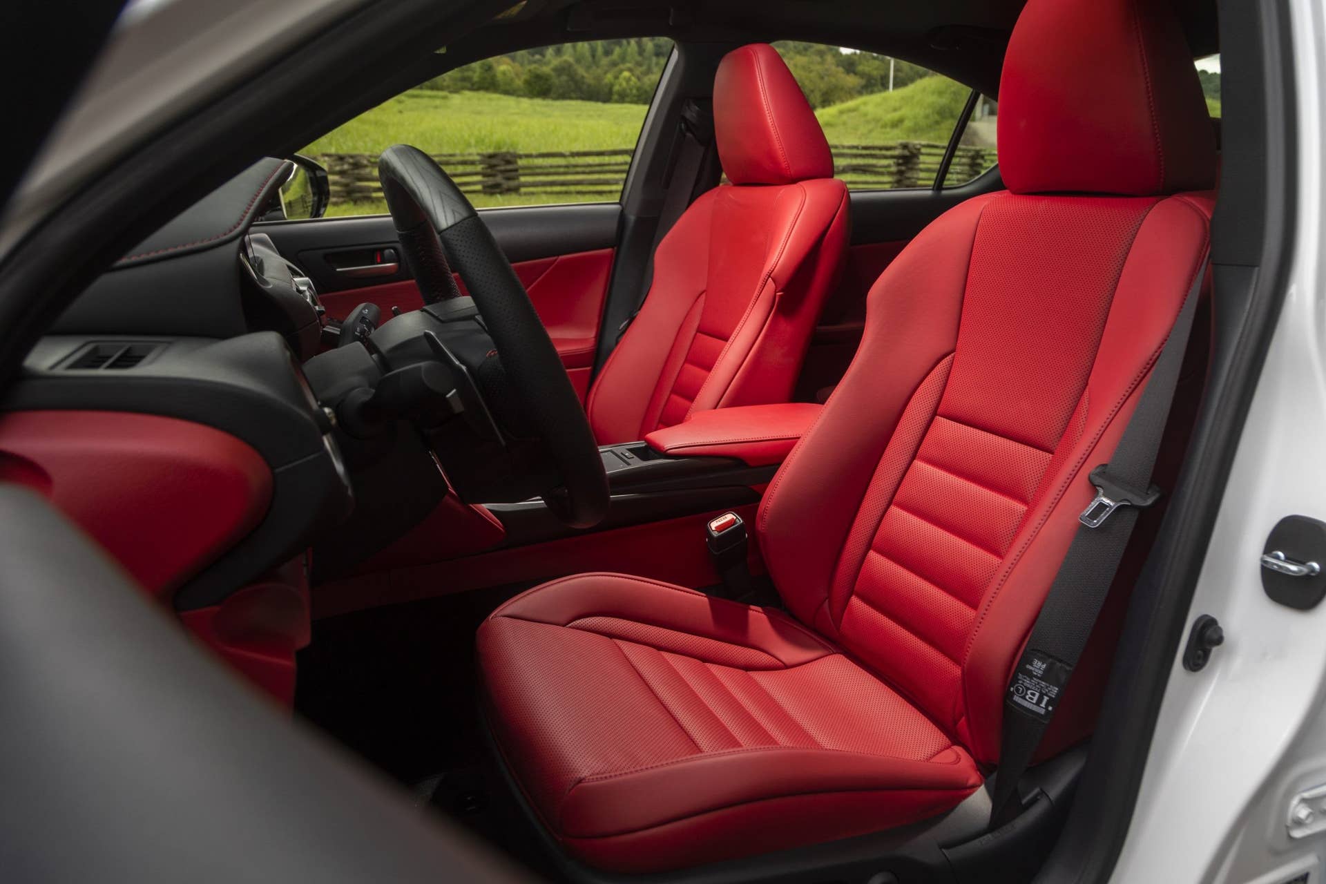 2025 Lexus IS 350 F Sport with red interior front seats