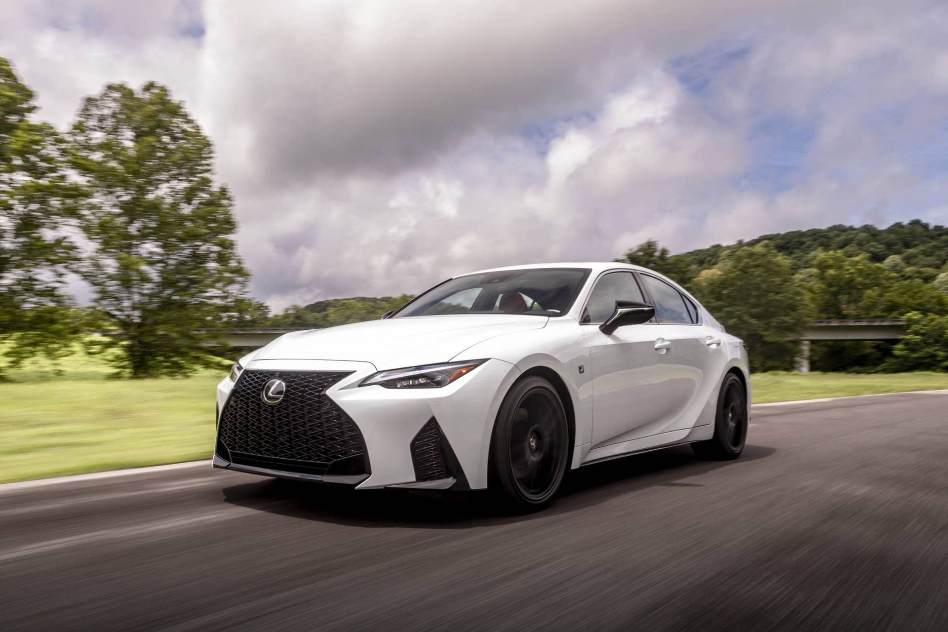 2025 Lexus IS 350 F Sport in white front angled view driving