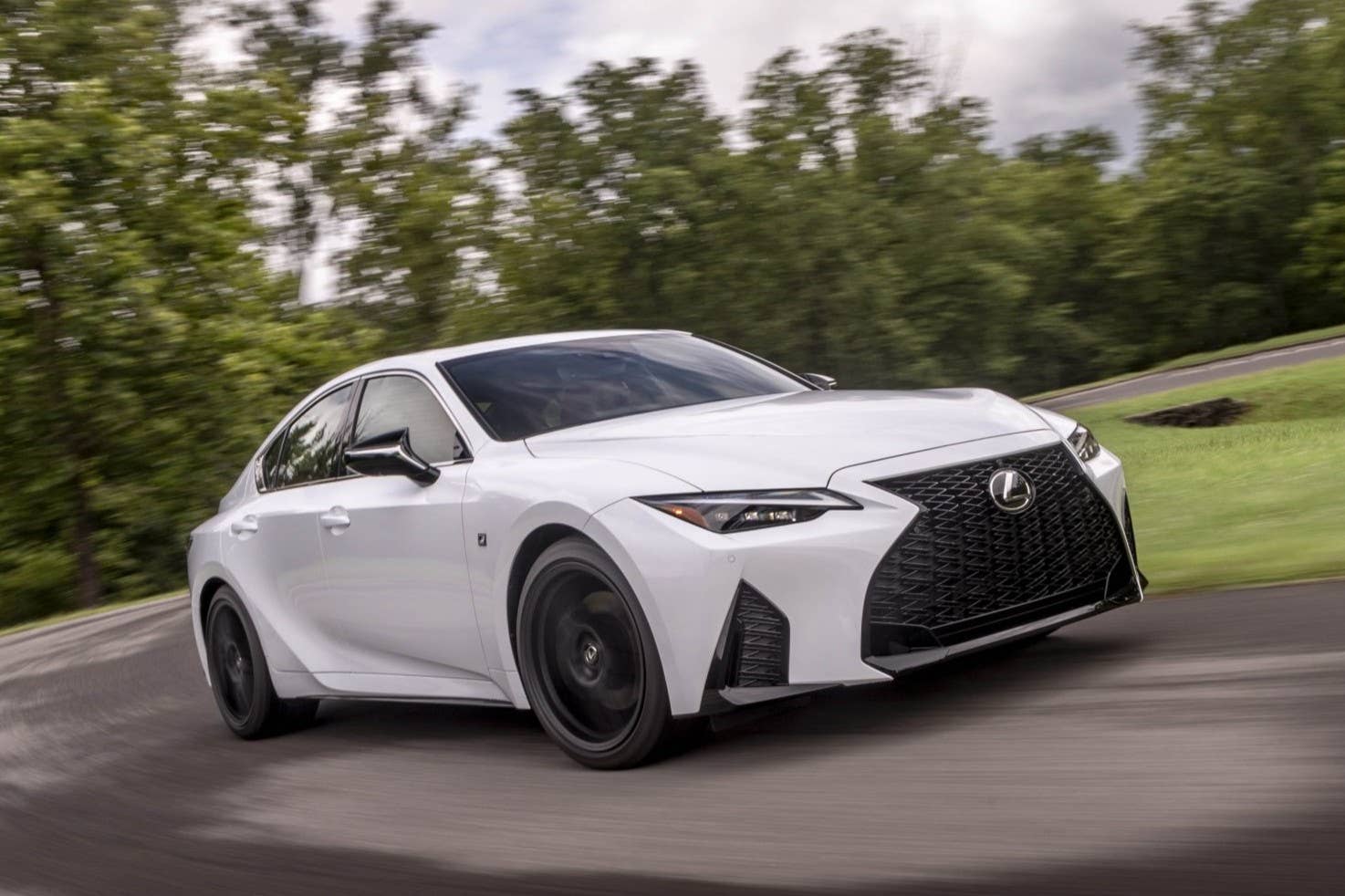 2025 Lexus IS 350 F Sport in white front angled view driving