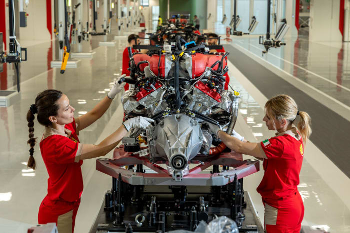 Engines make their way down the factory line. Only the V12s are built by one specific factory worker, whose name is slipped inside the components