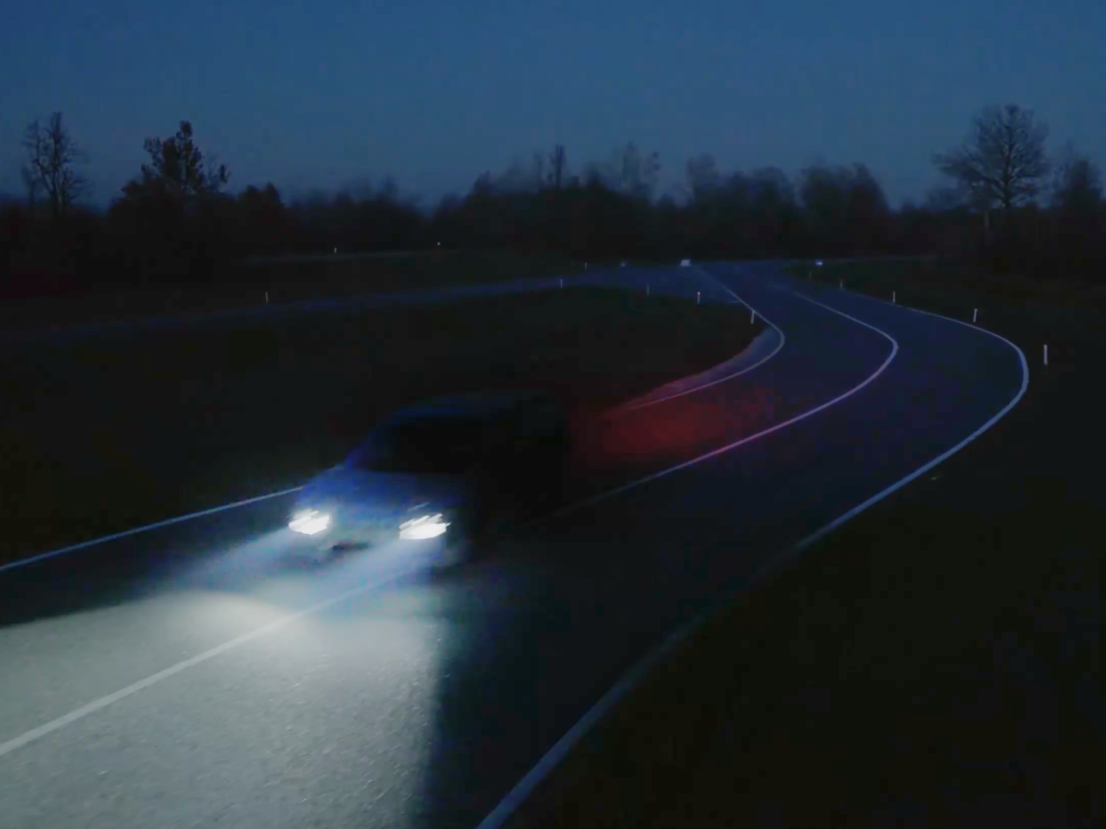 Ferrari Teases Its First EV With a Mysterious Nighttime Reveal - Autoblog