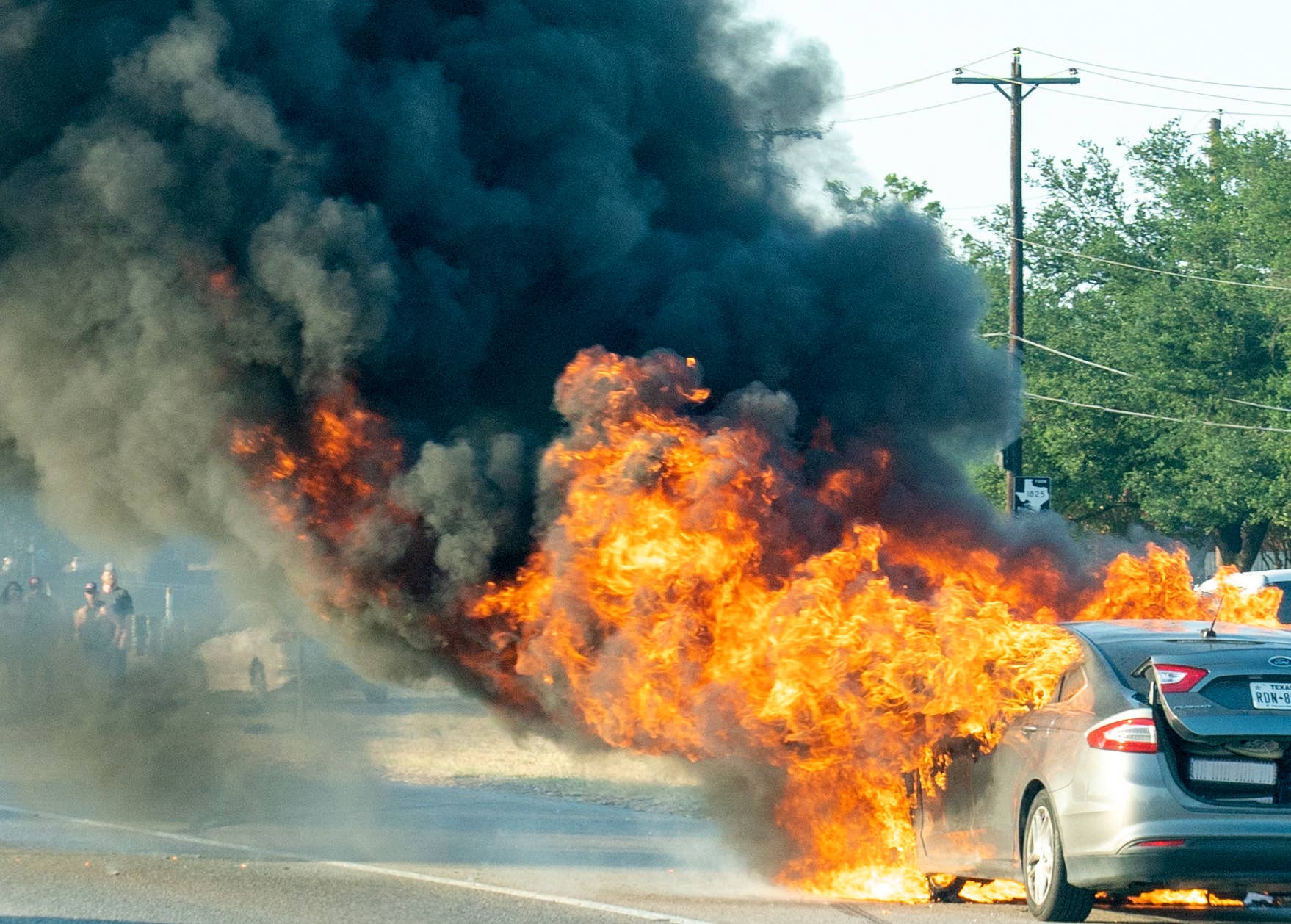 A Ford Fusion hybrid vehicle on fire just north of Austin, Texas, 2022