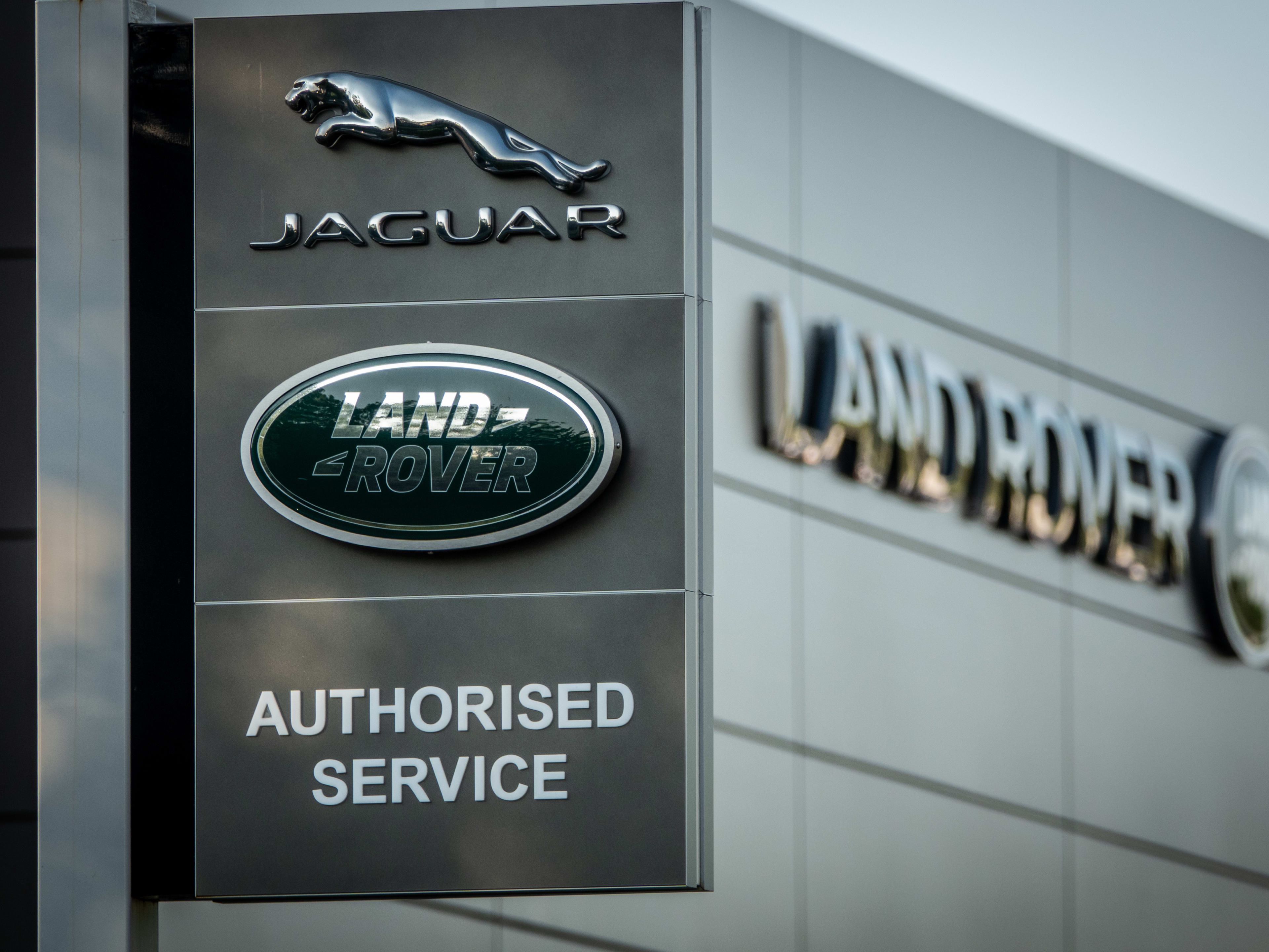 TAUNTON, UNITED KINGDOM ? MAY 08: The sun shines on the Land Rover logo displayed at a Jaguar Land Rover car dealership on May 8, 2025 in Taunton, England. The UK and US have announced a historic trade deal that will see the US removing tariffs on UK steel and aluminium, and cuts car rate to 10% which comes as welcome news for British built cars such as Land Rovers and Jaguars. (Photo by Anna Barclay/Getty Images)