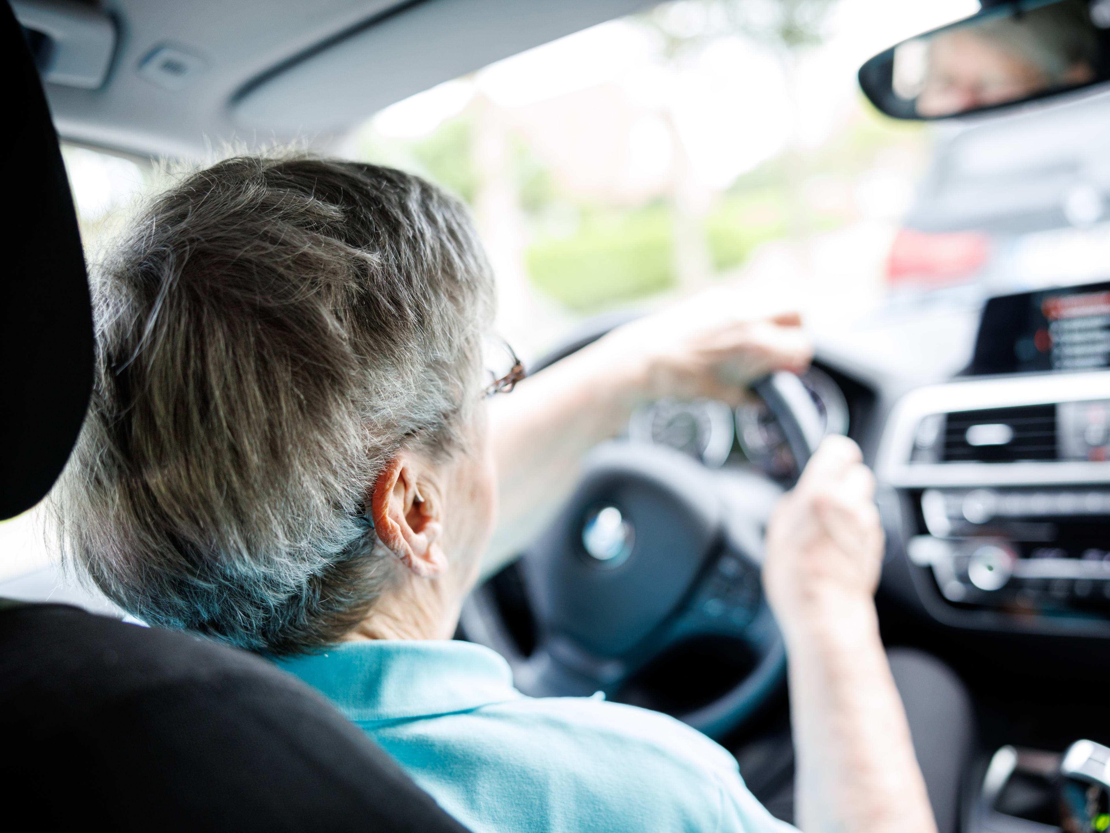 01 July 2024, Lower Saxony, Norden: An over 90-year-old woman sits behind the wheel of a car in Norden (Lower Saxony) on July 1, 2024. Driving in old age or the introduction of an aptitude test for senior citizens is always the subject of controversial debate. In Germany, there is currently no regulation that prescribes an age limit or driving ban for driving licenses. Photo: Matthias Balk/dpa (Photo by Matthias Balk/picture alliance via Getty Images)