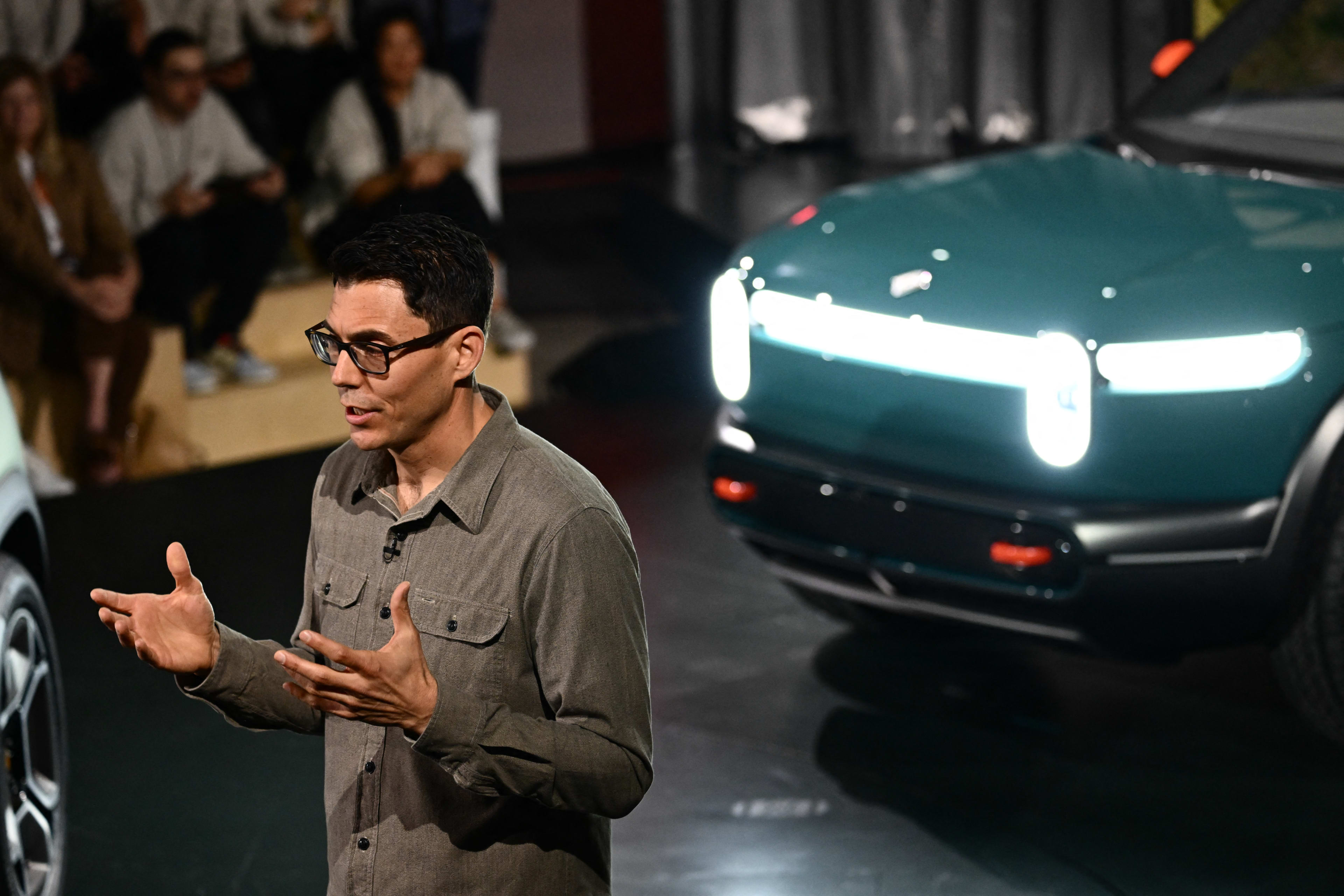 Rivian CEO Robert "RJ" Scaringe speaks at the launch of the Rivian R3X electric vehicle at the Rivian South Coast Theater in Laguna Beach, California, on March 7, 2024. (Photo by Patrick T. Fallon / AFP) (Photo by PATRICK T. FALLON/AFP via Getty Images)