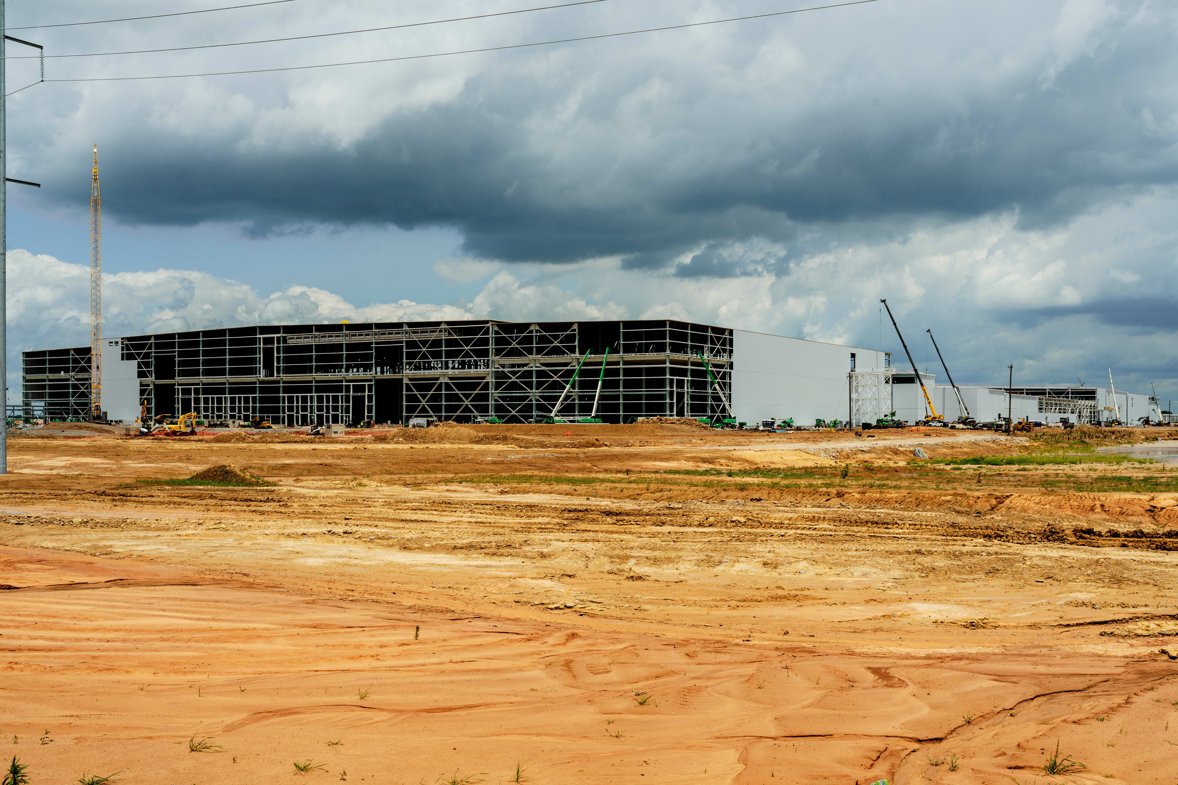 The BlueOval SK electric vehicle (EV) battery manufacturing facility under construction in Stanton, Tennessee, US, on Thursday, June 8, 2023. A deep-pocketed US government program designed to finance futuristic energy businesses is issuing a conditional $9.2 billion loan to Ford Motor Co. for the construction of three battery factories. Photographer: Houston Cofield/Bloomberg via Getty Images