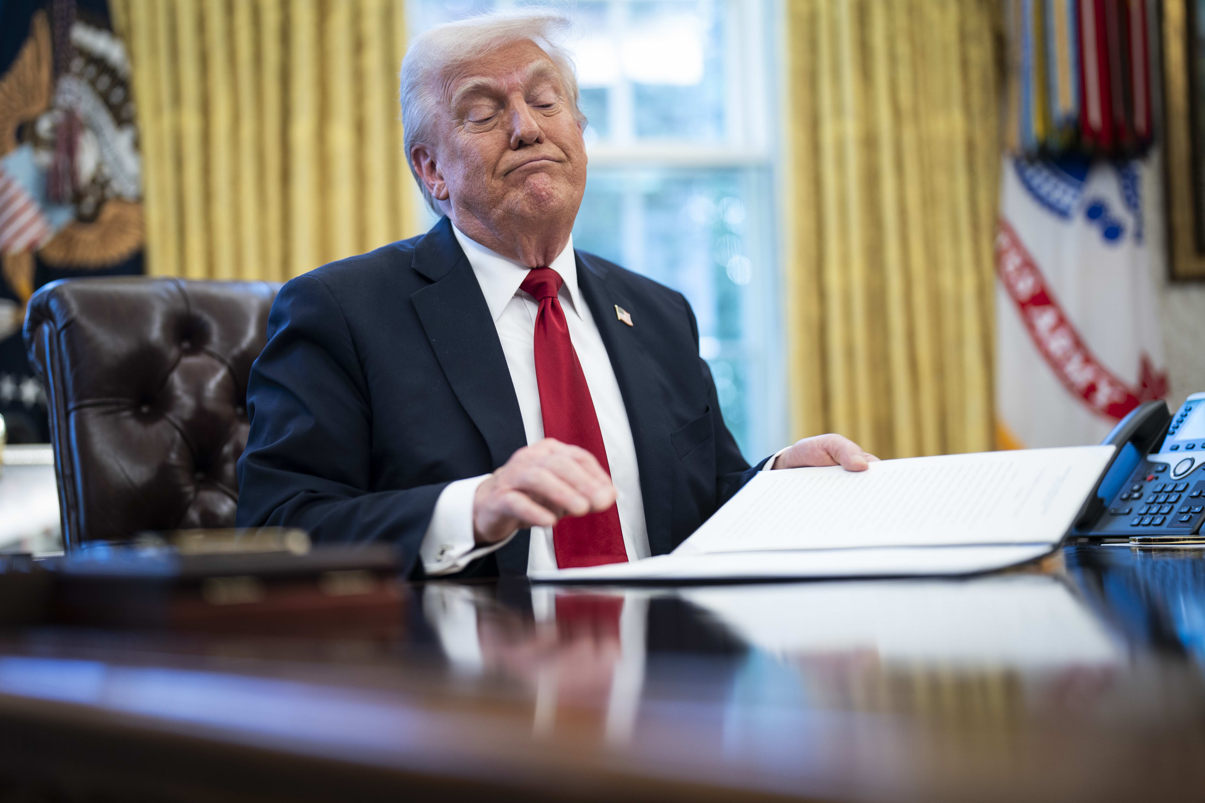 Washington, DC ? March 26 : President Donald J Trump signs an executive order related to auto tariffs in the Oval Office at the White House on Wednesday, March 26, 2025 in Washington, DC. (Photo by Jabin Botsford/The Washington Post via Getty Images)