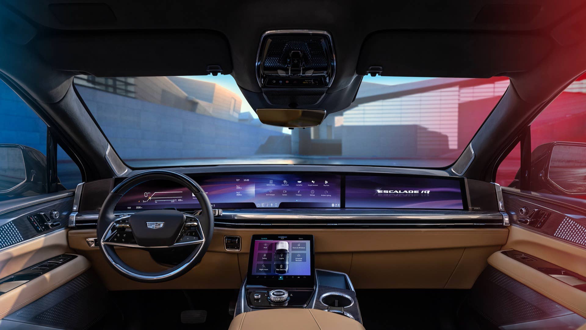 Forward-facing view of Cadillac ESCALADE IQ interior and 55-inch pillar-to-pillar screen from the rear seat.