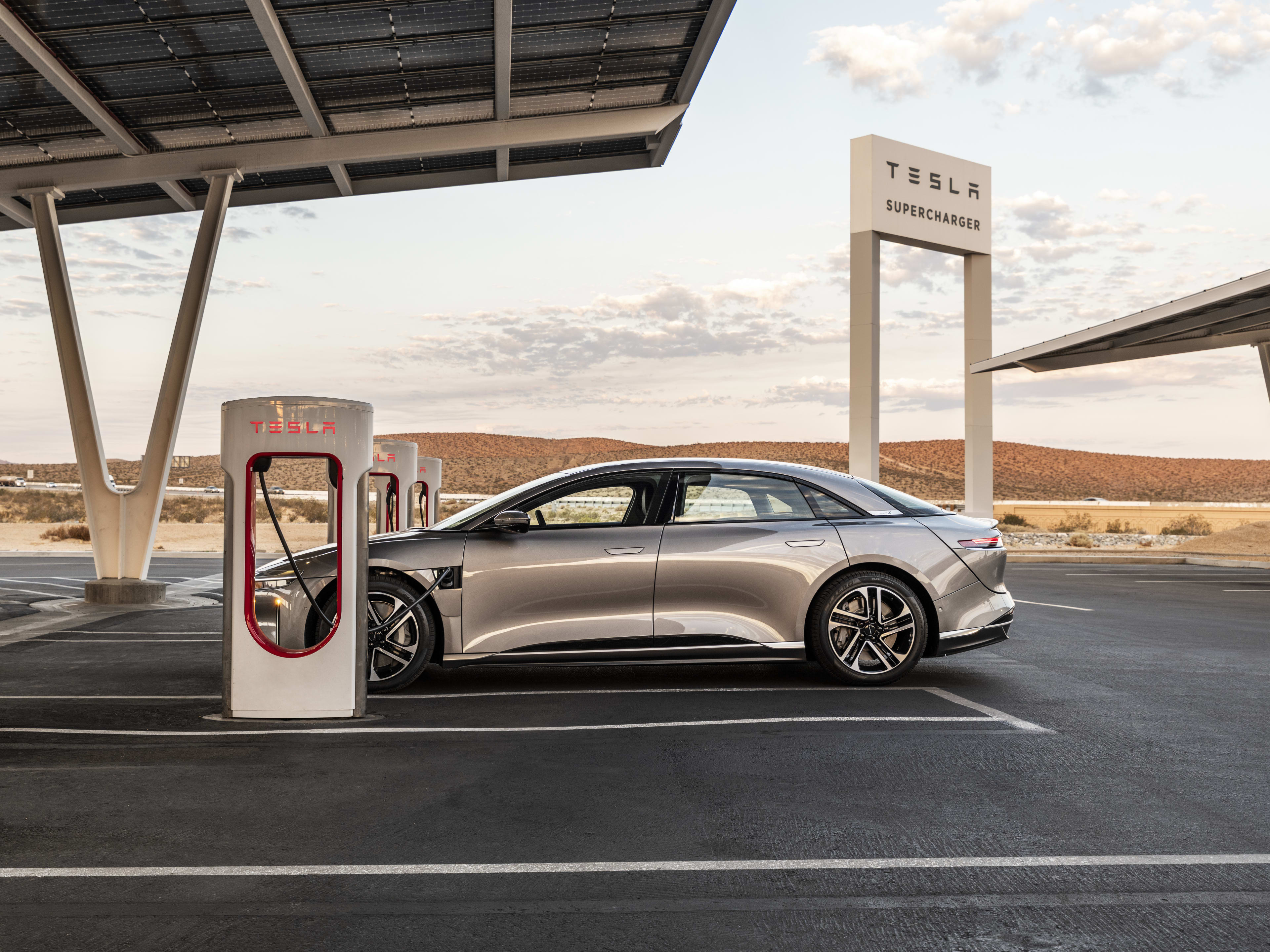 2026 Lucid Air charging at at Telsa Supercharger