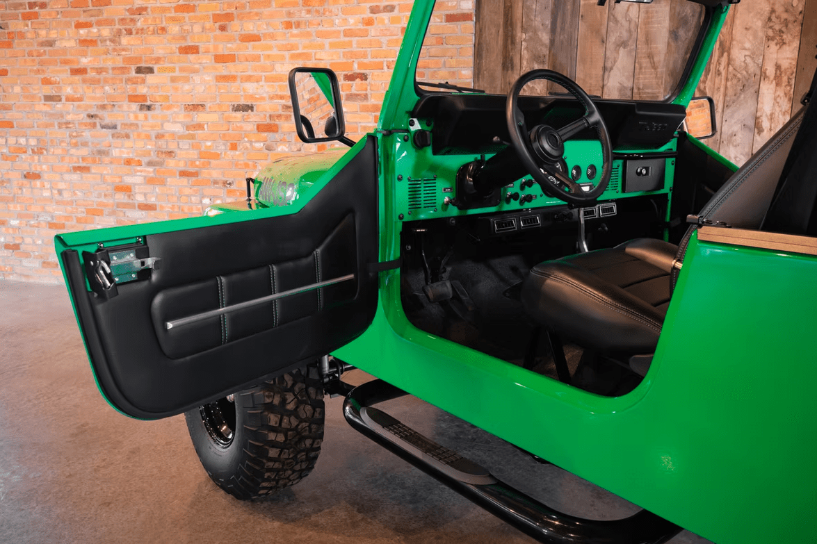 Jeep CJ-8 Scrambler Restomod by Blacksmith Garage: Python Green, Full Leather, Auction Oct 25 10 Jeep CJ-8 Scrambler ANV-JS2 Blacksmith Garage interior door open