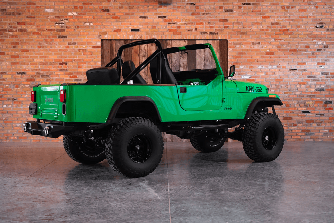 Jeep CJ-8 Scrambler Restomod by Blacksmith Garage: Python Green, Full Leather, Auction Oct 25 4 Jeep CJ-8 Scrambler ANV-JS2 Blacksmith Garage rear quarter roof off