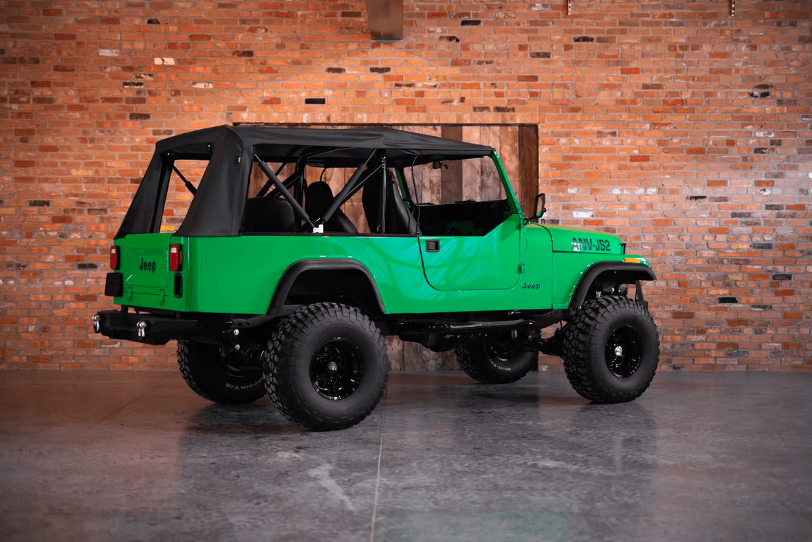 Jeep CJ-8 Scrambler Restomod by Blacksmith Garage: Python Green, Full Leather, Auction Oct 25 8 Jeep CJ-8 Scrambler ANV-JS2 Blacksmith Garage rear quarter roof on