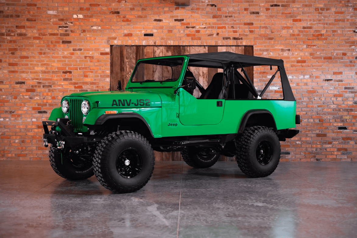 Jeep CJ-8 Scrambler Restomod by Blacksmith Garage: Python Green, Full Leather, Auction Oct 25 9 Jeep CJ-8 Scrambler ANV-JS2 Blacksmith Garage front quarter roof on