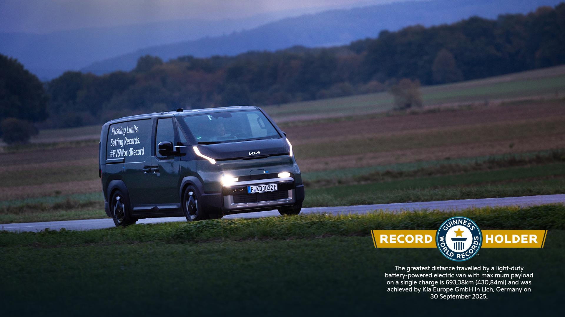 An evening driving shot of the Kia PV5 that secured a Guinness World Record for range on a single charge