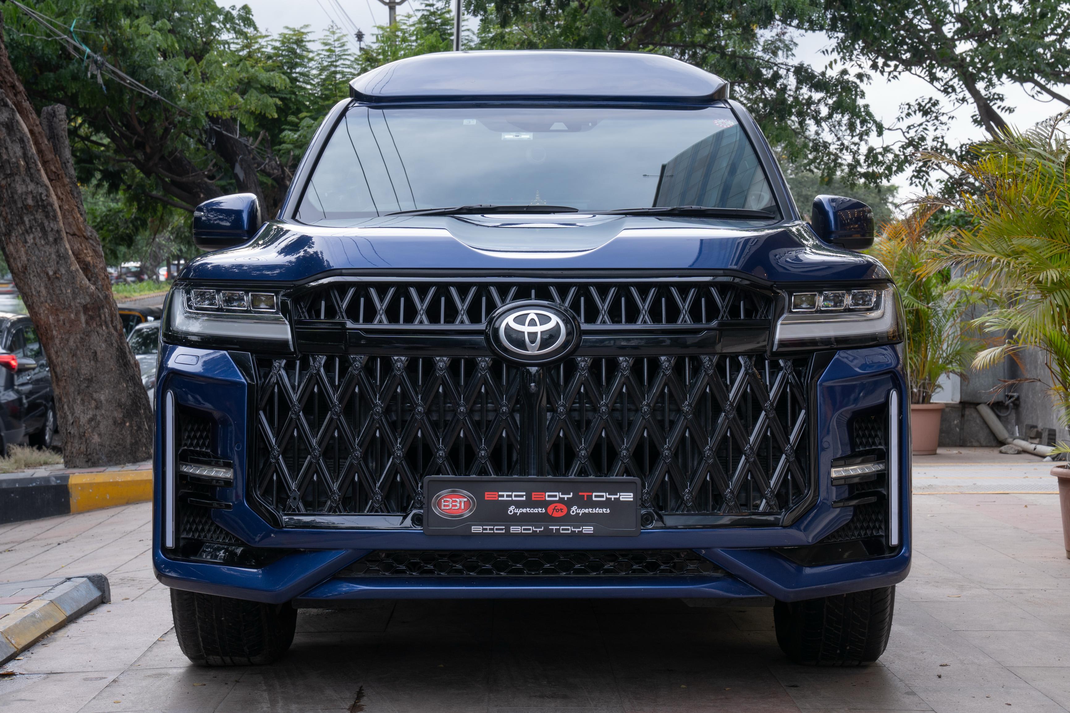 Toyota Land Cruiser 300 limo Specs: Starlight Headliner and Twin-Turbo V6 3 Front view and grille of the custom Toyota Land Cruiser 300 Limousine